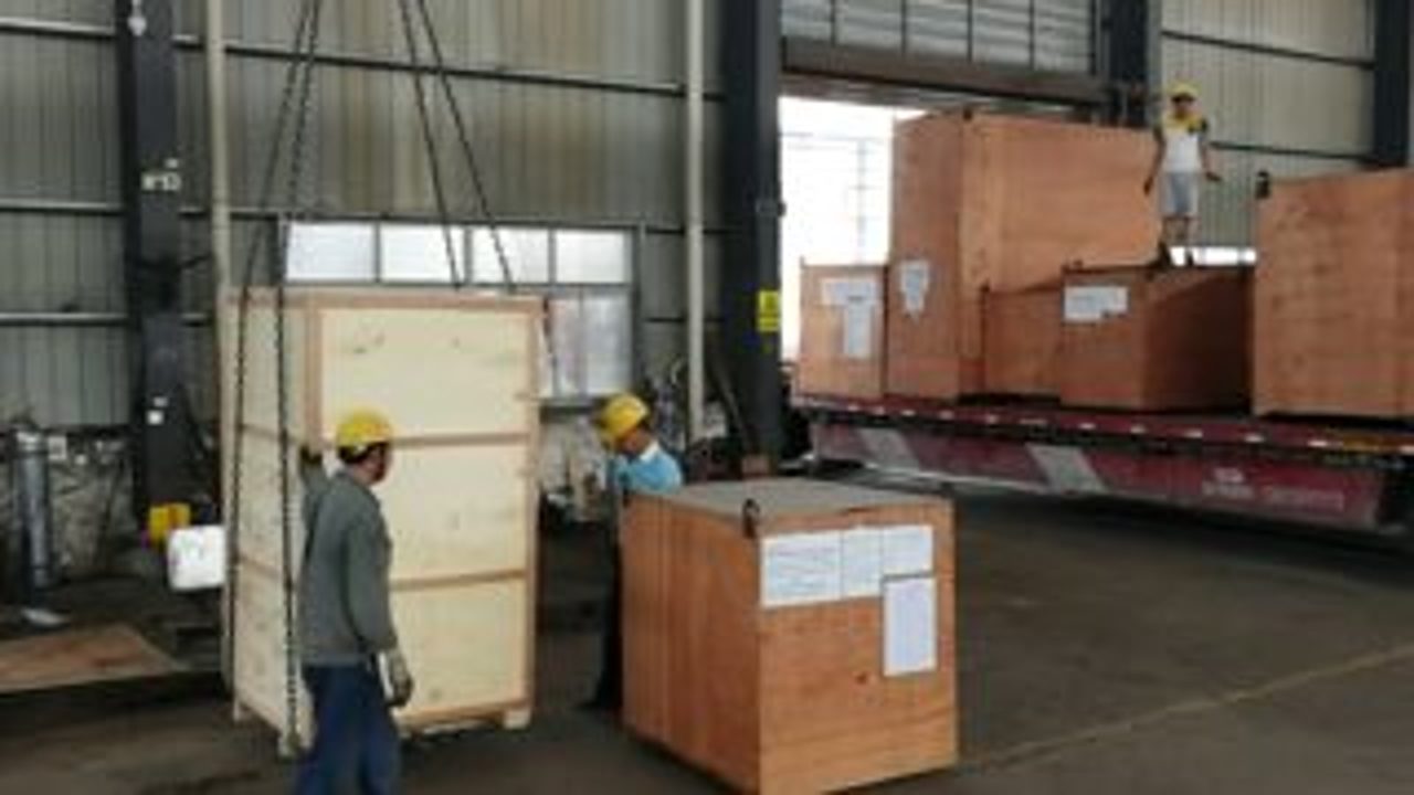 Wooden crate packing and flatbed truck loading for export