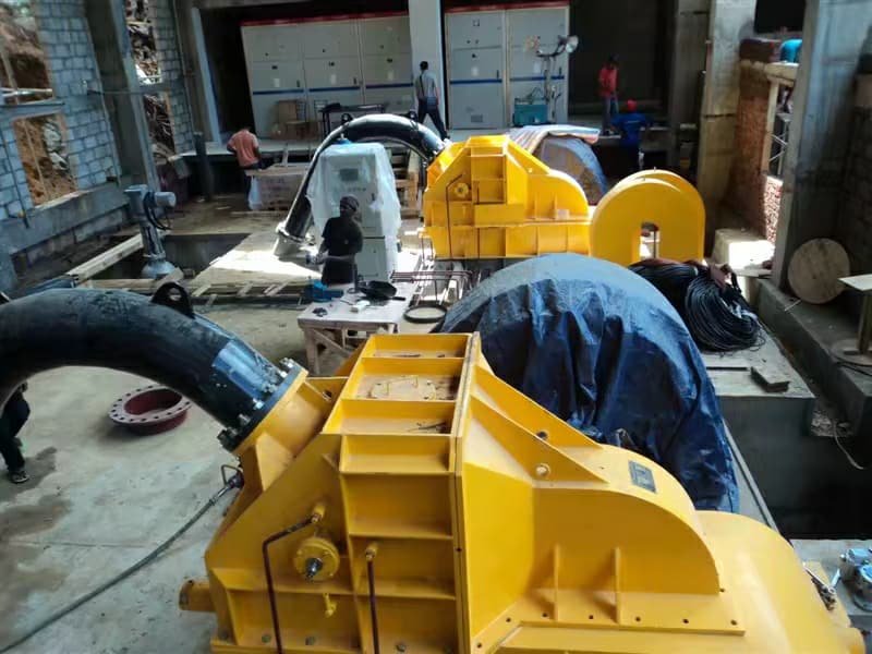 Pelton runner and nozzle components during assembly