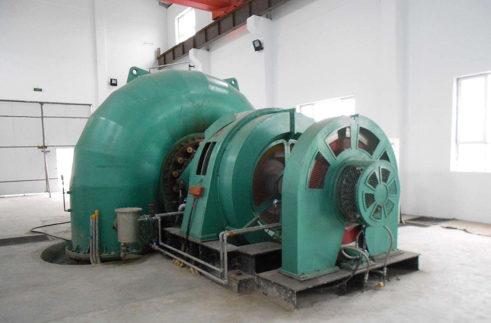 Horizontal Francis turbine-generator set with exciter inside the machine hall at Jinghe hydropower plant