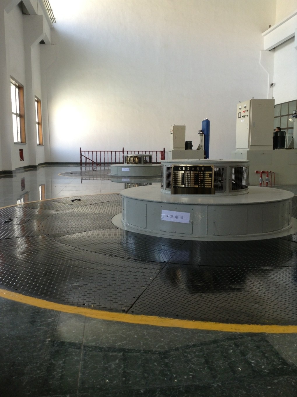Vertical turbine-generator unit with rating nameplate at Nachitai hydropower plant