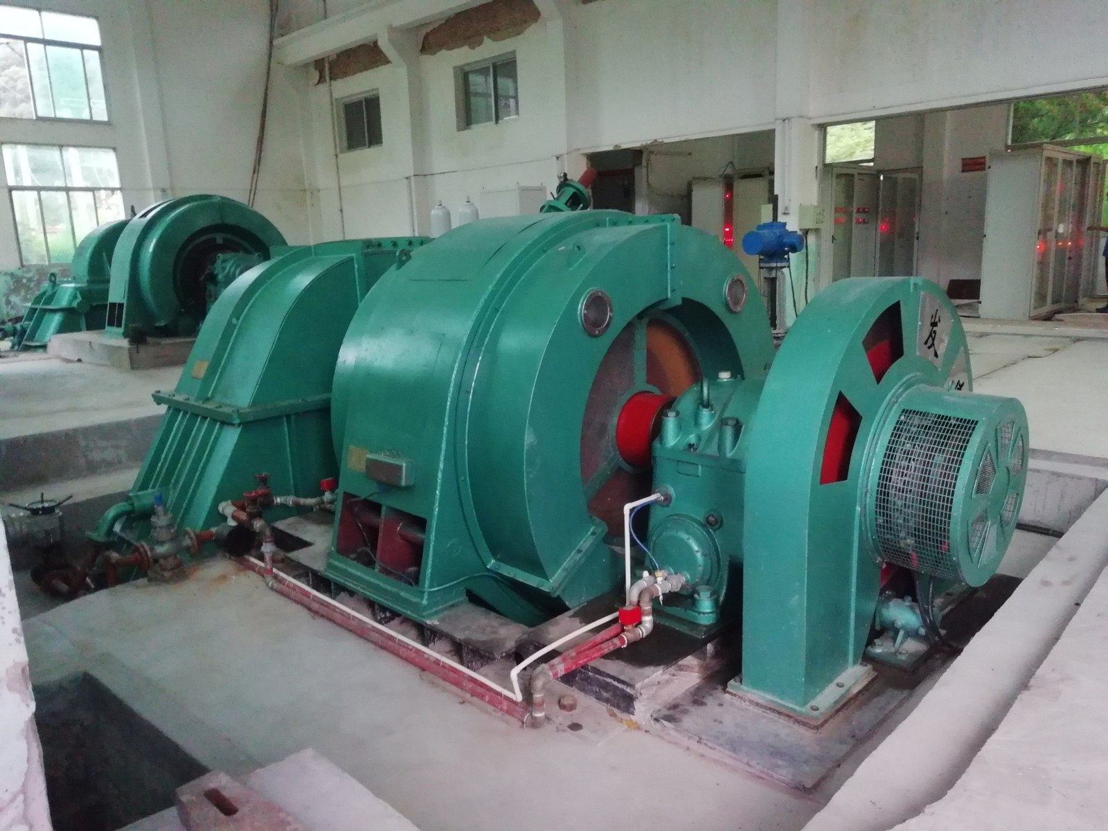 Horizontal impulse turbine-generator unit with generator guard