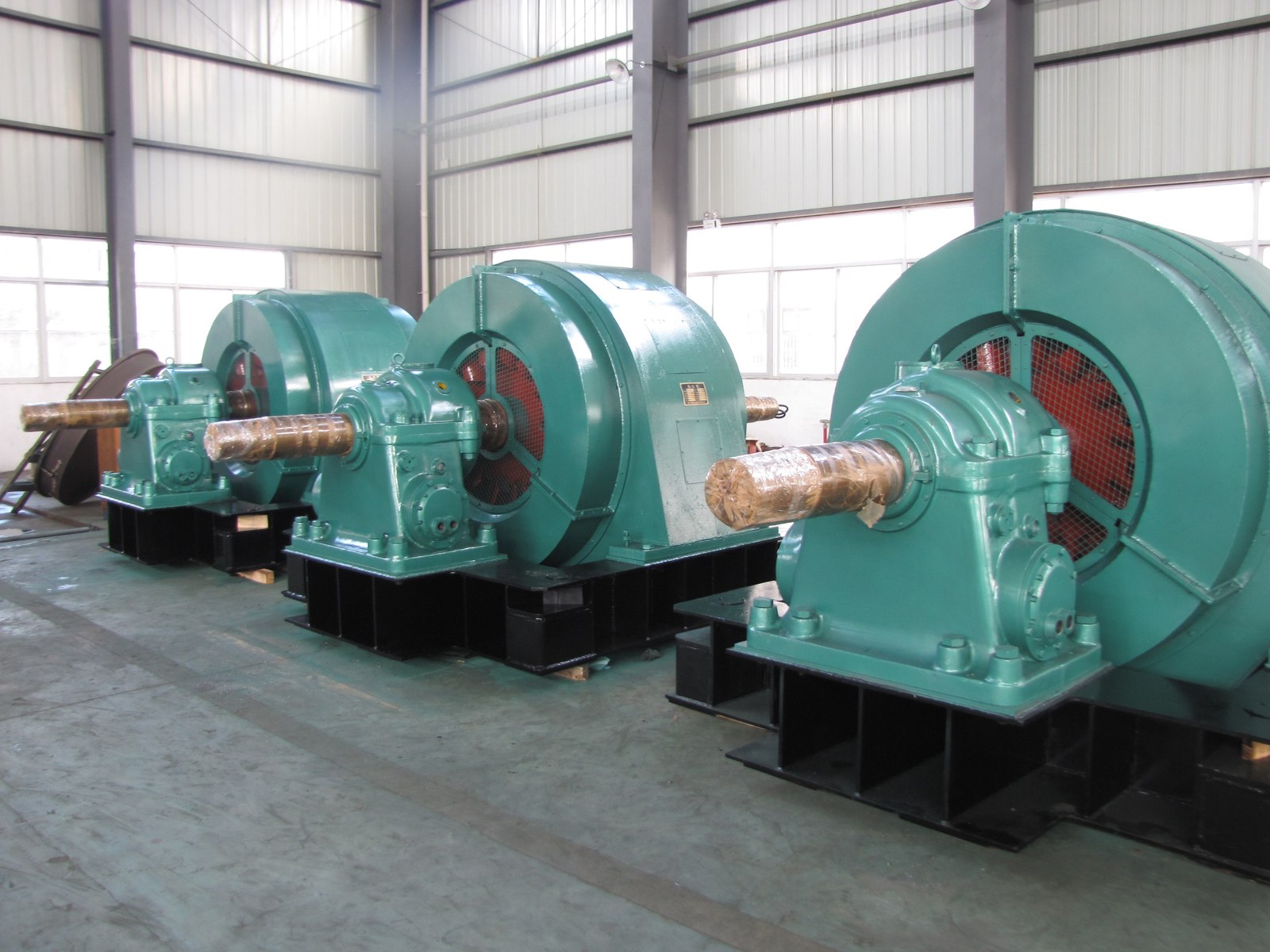 Finished horizontal hydro generators lined up in the works