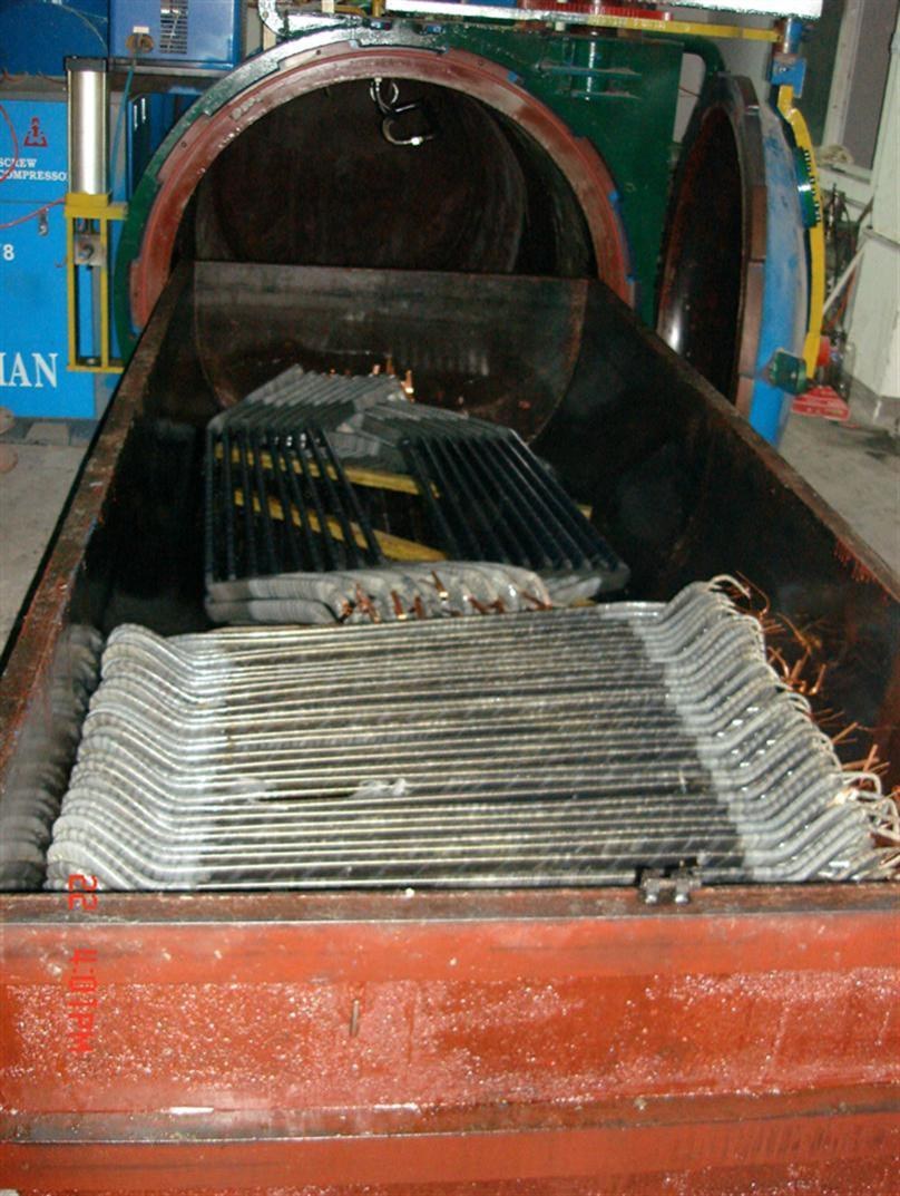 Stator coils entering the vacuum pressure impregnation vessel